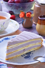 Taro mille crepes cake  on white plate