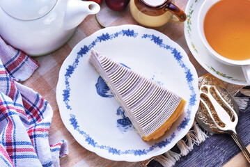 Taro mille crepes cake  on white plate