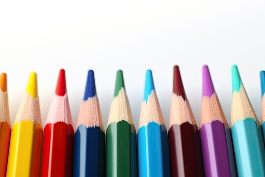 Colored pencils creatively arranged, captured in a close-up shot to highlight their intricate, vibrant hues and the artistic possibilities they hold.