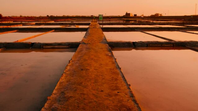 The salt ponds or salt fields of Aveiro, Portugal by sunset, perfect shimmering mirrors that capture the essence of this coastal town