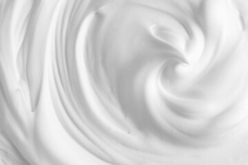 Thick foam swirl texture. White cream, mousse, cleanser, shampoo, shaving foam. Foamy cosmetic product closeup - obrazy, fototapety, plakaty