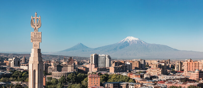 Fototapeta Yerevan cityscape with Mount Ararat. Panorama of the Armenian capital center and mountains. Scenic view from the Cascade monument