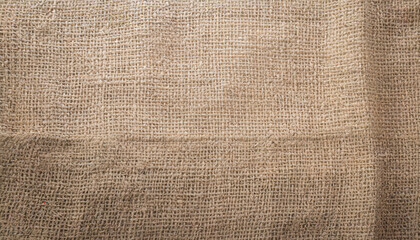 jute hessian sackcloth canvas woven texture pattern background in light beige cream brown color...