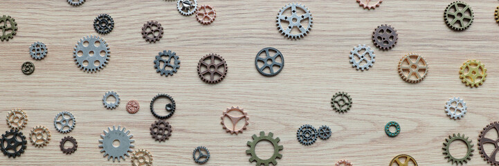 Small gears and cogs representing brain functioning on table