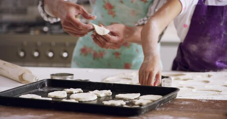 Home, baking plate and mother with girl, dough and development with skills, childhood and learning. Family, mama and kid with ingredients, equipment and recipe with instructions and cookie cutter