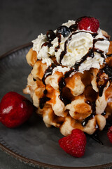 Sweet Belgian waffle with whipped cream and fruit