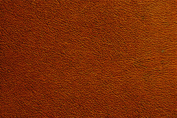 The textured surface of leather, providing a tactile and refined quality, often used in fashion and...