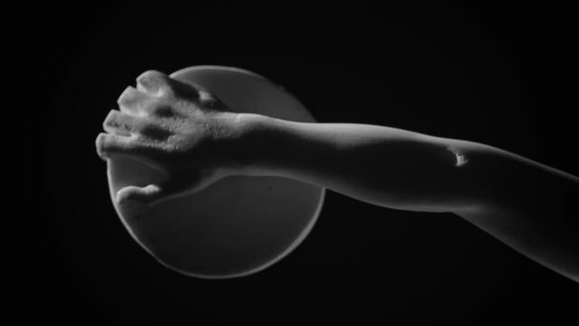 Closeup footage of the hand and discus of the Discobolus (Discus thrower) marble sculpture by Myron