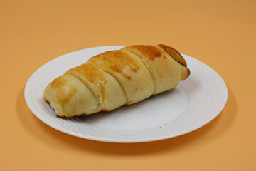 sausage roll on white plate and isolated background