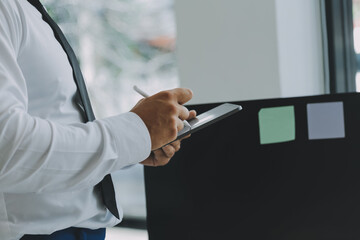 Construction and structure concept of Engineer or architect meeting for project working with partner and engineering tools on model building and blueprint in working site, contract for both companies.