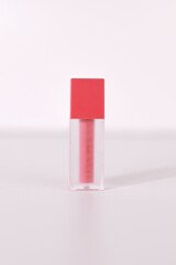 close up, bottle of lip tint glosses on white background