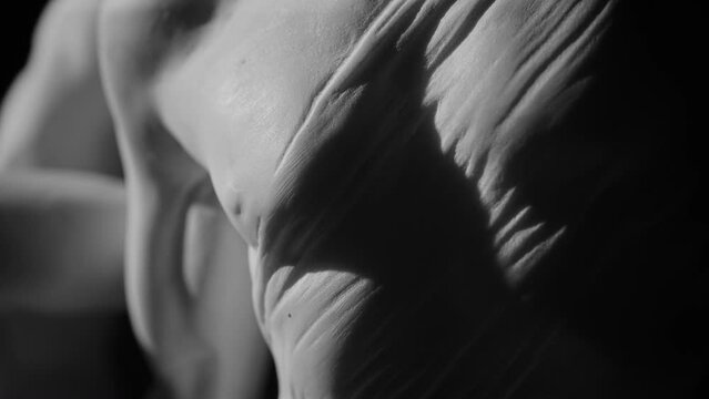 Closeup view of the detail on the front side of the marble sculpture of Hercules and Lichas