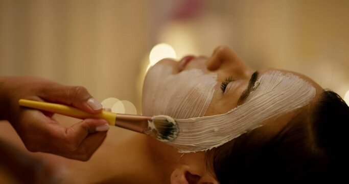 Relax, spa and woman with facial mask for beauty, health and wellness dermatology treatment. Luxury, self care and closeup of female person with face mud for healing routine in a peaceful salon.