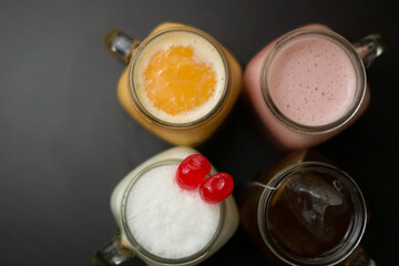 A variety of fresh drinks and smoothies on a table