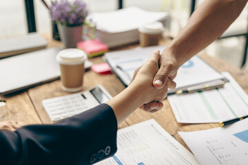 The hands of a team of businessmen joining forces celebrate the concept of unity. A close-up photo of a team working together to make business successful. teamwork business