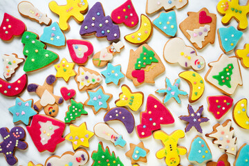 Large group of delicious, homemade Christmas honey cookies with fondant in many different shapes...