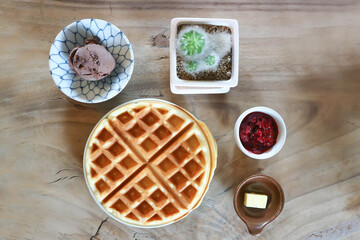 waffle with strawberry dressing and chocolate ice cream