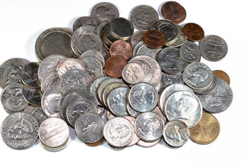 Pile of American coins of different times and values, 1 cents, dimes, quarters, half dollars, and...