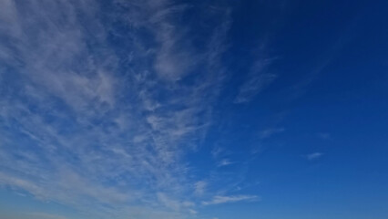 Naklejka na ściany i meble beautiful big white clouds in the blue sky bg - photo of nature