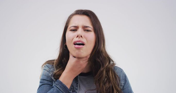 Woman, cough and sore throat with allergy, choking and hand on neck, relief and virus. Medical, bacteria and pain for health issue, tuberculosis and asthma on studio grey background, infection or flu