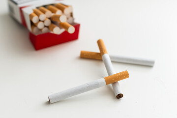 cigarettes form as three crosses on white background