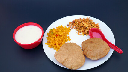 Indian food deep fried Puri Bhaji or Aloo ki Sabji, Potatoes and kheer.