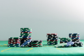 on a black background flying cards for poker, worth a bundle of dollars and a set of chips for the casino, with reflection