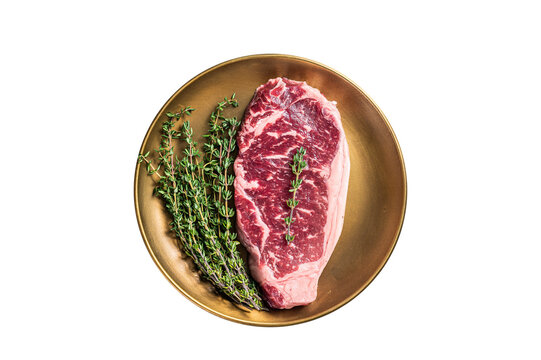 Uncooked Raw New York beef steak with thyme. White background. Top view