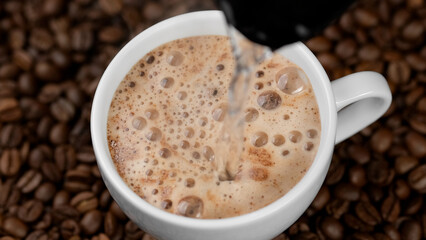 Hot instant coffee with foam close up