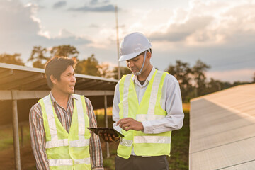 Two engineers discuss maintenance plans for solar cells. Renewable energy with solar generators. Renewable energy concepts for the future world.