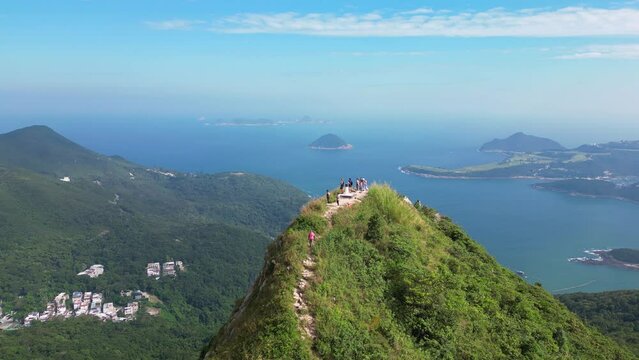 Sai Kung, Hong Kong: Aerial drone footage of the High Junk Peak in the new territories of Hongkong with the stunning beach of clear water bay in the background. 