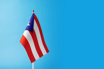 puerto rican flag on a blue background, copy space, independence national day of puerto rico,...