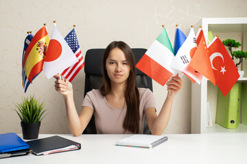 Language learning, student with foreign flags at language school