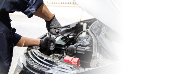 Close-up hand auto mechanic using the wrench to repairing car engine problem. Concepts of check and...
