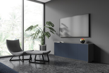 Gray living room with armchair and TV - obrazy, fototapety, plakaty