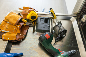  repairing a dishwasher with tools