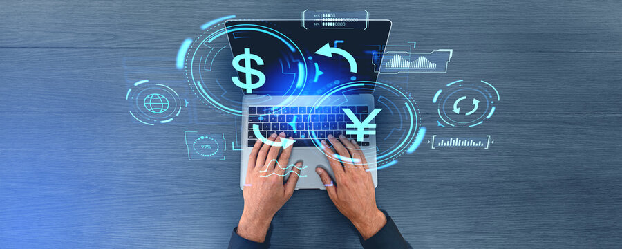 Man hands with laptop and yen yuan dollar exchange icons