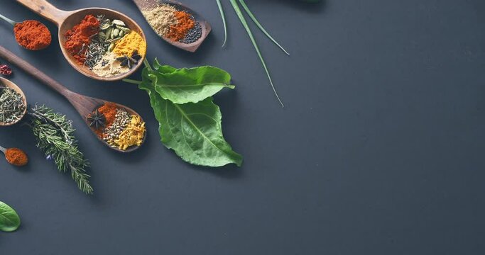 Spices, herbs and condiments for curry, leaves and studio for seasoning, spoons and advertising. Food, natural or different for organic, chilli or marketing for ingredients, dark backdrop and dry