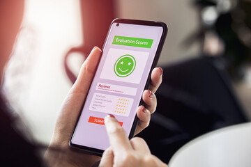 Customers choose emoticons rating to service on online application. concept of customer satisfaction surveys, reviews of store products to evaluate the quality leading to business reputation ranking.
