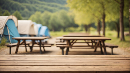 Fototapeta premium empty table with defocused background at camping site with tents
