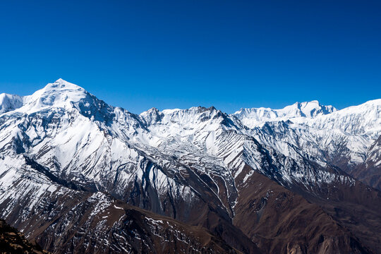 Beautiful snow-covered mountain range in Himalayas, Nepal. View from peak near Muktinath village, Mustang.