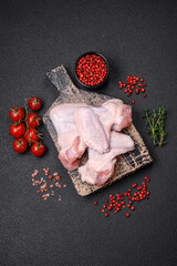 Fresh raw chicken wings with salt and spices prepared for baking