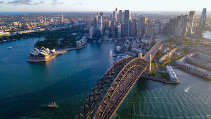 Aerial drone view of Sydney City and Sydney Harbour showing Sydney Harbour Bridge in the late...