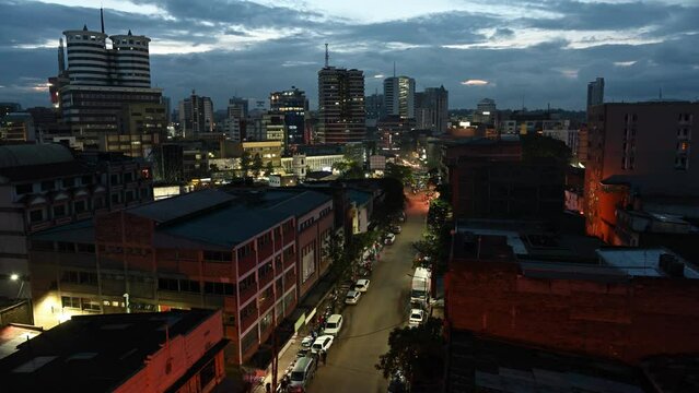 Downtown of night Nairobi. The busy streets with hurrying cars and people. Kenya, Africa
