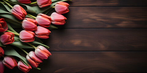 Bouquet of red tulips on a wooden background. Spring flowers Anniversary card with tulips on wood, flowers on wooden background A bouquet of tulips lies on a brown wooden background.AI Generative