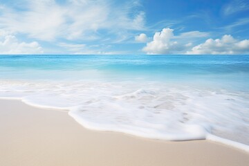 Fototapeta na wymiar Soft Wave of Blue Ocean Hitting the Sandy Beach - Captivating Coastal Image