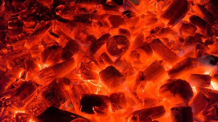 Burning firewood in the fireplace close up, BBQ fire, charcoal background. Charcoal fire with sparks. Fire background.