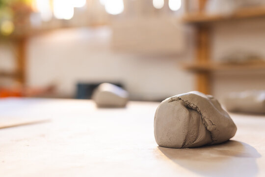Close up of clay lying on desk in pottery studio