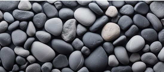 Fototapeta na wymiar Background of gray stones in top view