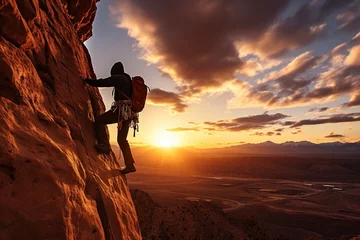 Fotobehang rock climber at sunset © Belish